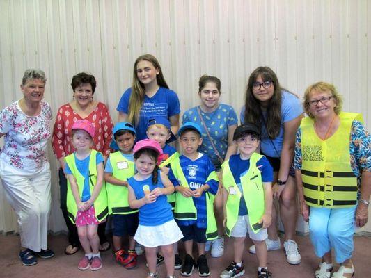 Children and staff pose for photos during Vacation Bible School, summer 2018.