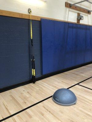 TRX + Bosu ball station set up for 210 Elite fitness class.