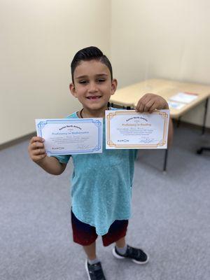 Happy Kumon student receives Proficiency Certificates in Math and Reading. Look at that smile!