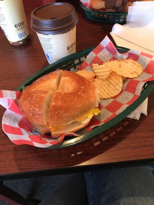 Egg and cheese on a plain bagel with chips  and great coffee!