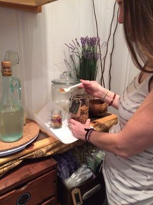 Making her very  own tea blend in the DIY corner.