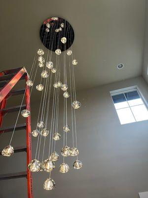 Hang a high ceiling chandelier