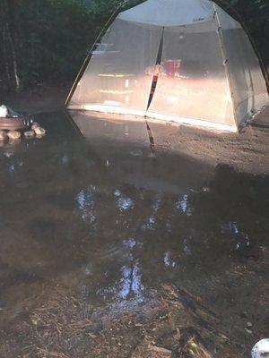 Water extends completely under picnic table