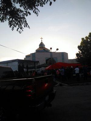 Giant gold cross on top of church