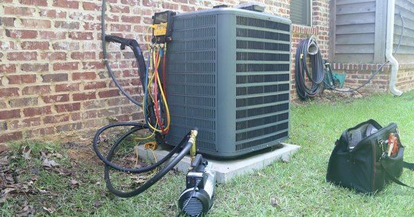 An air conditioning system sits beside a residential home in Athens, GA ready to provide cool relief during hot summers...