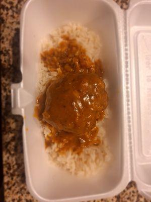 Chopped beef and rice and gravy.