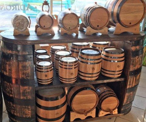 New oak barrels for sale, ranging in size from 1-100 liters (30 gallons).