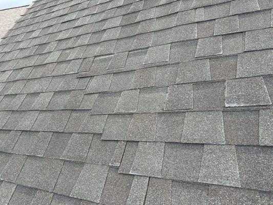 Roof shingles that are not properly nailed and shifted