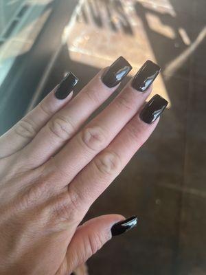 This was what they did when I went back; she painted black gel over the nails and charged me $25. So these are my $75 nails!!