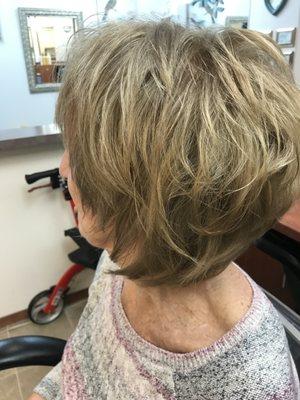 A razor cut bob with lots of texture it's a by leavel bob . It's fun and new for bobs this year.