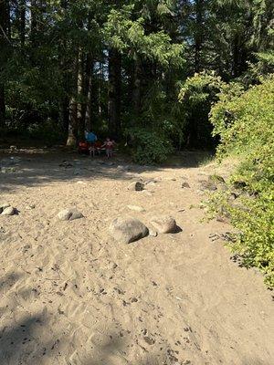 Sandy rocky place with shade to set up chairs