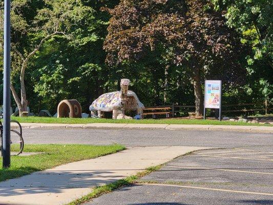 A turtle statue in the picnic area.