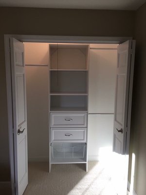 Freshly painted closet with organizer.