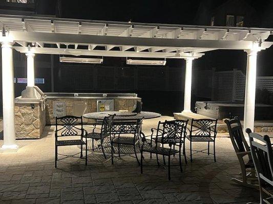 Pergola, outdoor kitchen paver patio with inset spa