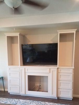 Entertainment center with electric fireplace insert.