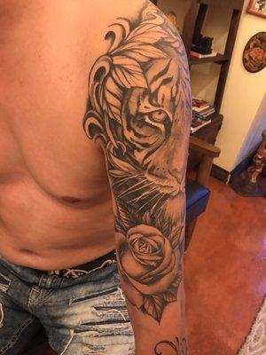 Tiger tattoo with roses and lady face