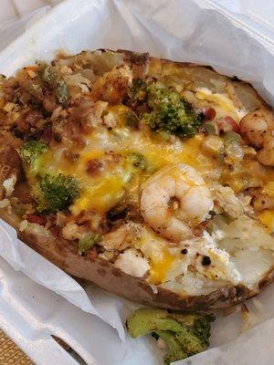 This 93 potato baaabbbyyy! Shrimp, chicken, broccoli, onions, peppers, sour cream and cheese. This is a MEAL!