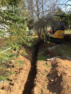 Trench dug with compact excavator