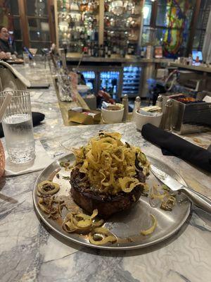 Bone in rib-eye with mashed potatoes and fried onions. The best steak I've had in a long time!!