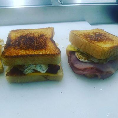 Our Morning Breakfast Sandwich choice of thick bacon, ham, homemade sausage party on grilled Texas Toast