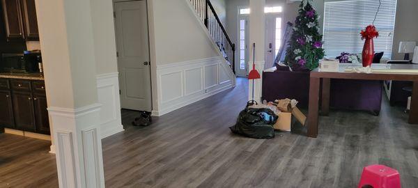 Water damages drywall & wood trim repairs and total new luxury vinyl flooring installation  after photo.