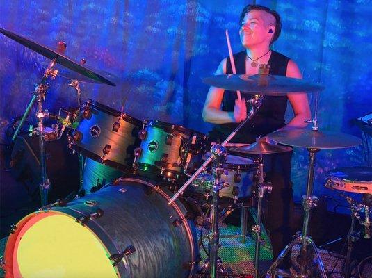 Sandi Grecco playing drums.