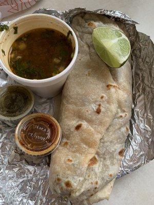 Carne asada burrito with side of consume