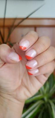 Angled french tip gel manicure.