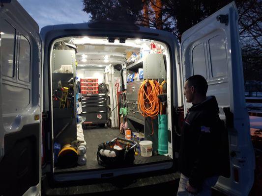 Providing great service 24 hours a day. A photo of Doug burning the midnight oil installing a new AC system for a "VERY HOT" customer