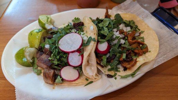 Lengua (beef tongue) taco left, al pastor right