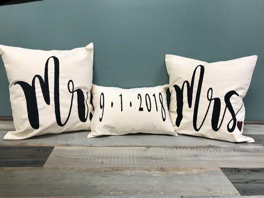 Canvas pillows used as photo props at a wedding