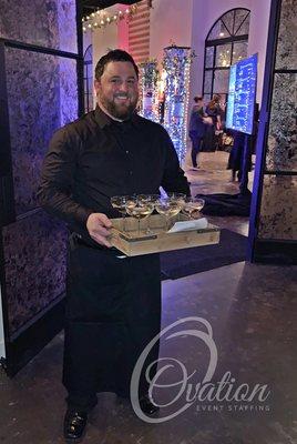 Team Member Josh serving up the signature drink with a smile at a Gala in March.