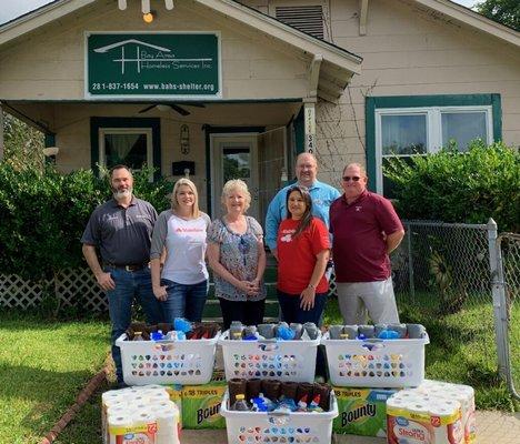 Making donation to Bay Area Homeless Shelter.