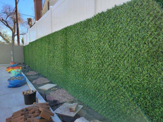 Drive way wall covered with grasstik