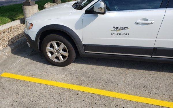 Martinson car with closeup of parking lot stripes.