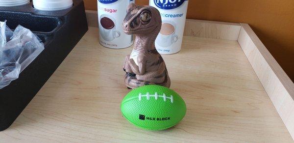 Bob the Raptor says "The H&R Block Mammals will take you taxes to the end zone... I love football puns!"