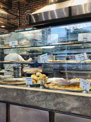 Pizzas in Glass Display Cases