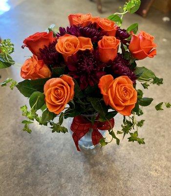 Show your passion by picking up this sexy Valentine's Day coral and merlot dozen rose arrangement