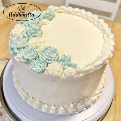 8 inch, 3 layer Vanilla Cake with vanilla buttercream and buttercream roses