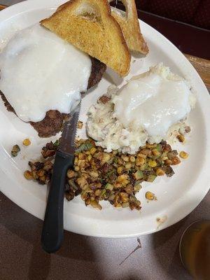 Chicken fried steak with mashed potato and corn