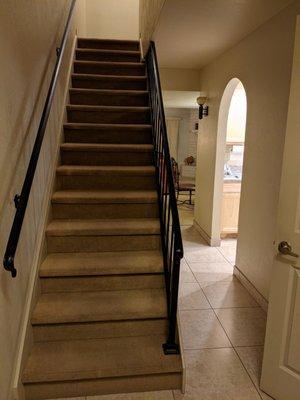 Staircase up to the bedroom and also a Murphy bed.