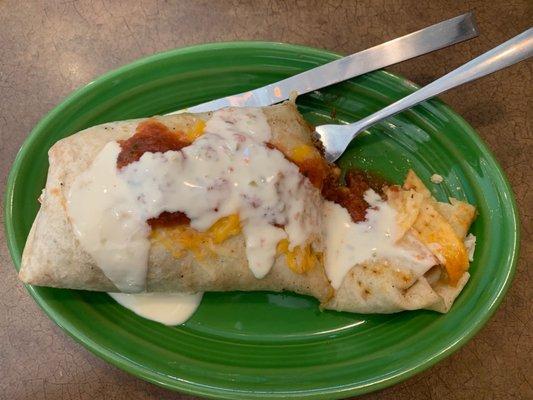 Stuffed burrito without the optional sides of beans and rice. Poured queso and salsa on top