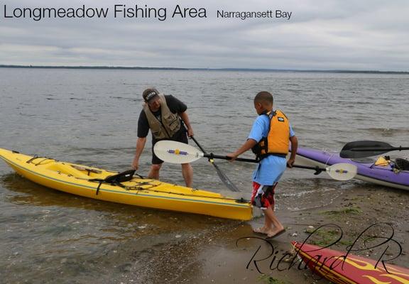 My youngest getting ready for his first kayaking lesson with a master.