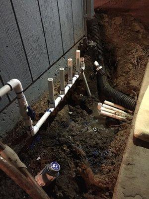 New sprinkler valve manifold and drainage system without concrete walkway removal