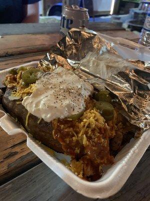 Buffalo chicken baked potato with jalapeño, sour cream, cheddar cheese