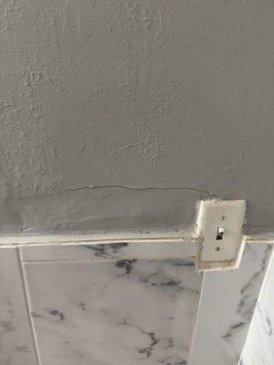 Walls cracking and repaired badly.