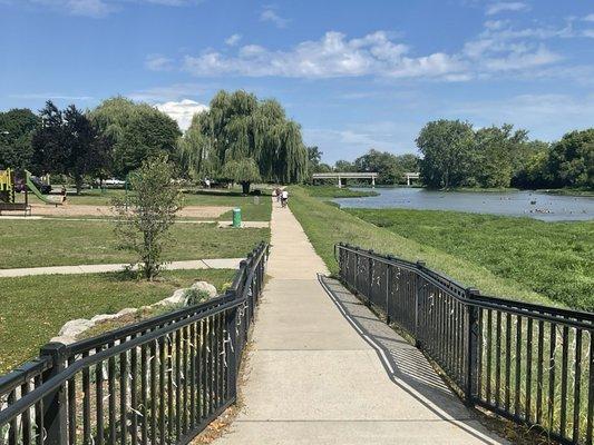 Jogging and bicycle trail leads over the bridge next to the river