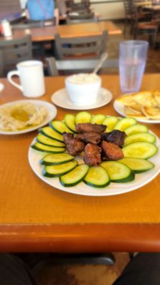 Lamb kebab, baba ganoush & grits.