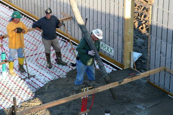 Workers at BASF's Wildlife Habitat and Environmental Education Classroom in Rensselaer, N.Y. level freshly poured concrete.