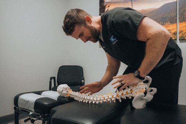 The doc demonstrating a side posture adjustment.